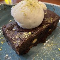 Vegan chocolate brownie with ice cream  at Il Forno in Bournemouth