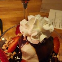 Gelato over warm brownie and strawberries at Osteria Du in Toronto