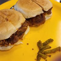 The yummiest dabeli - ask for it without butter. A Gujarati street snack that has a flavorful mashed potato mix in local bread with some masala peanuts, fresh pomegranate and some  at Swati Snacks - Mumbai in Mumbai