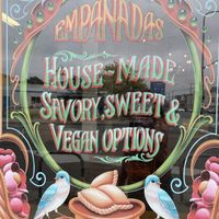Love the art work on the window advertising vegan options  at Cafe Buenos Aires in Berkeley