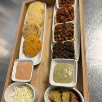 Arepita con jackfruit, chickpeas, ground meat with red lentils and black beans. Cheese violife and plantain.   at Origamy Gelato in Sunrise