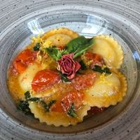 “Cheese” (I think cashew or almond) Ravioli with tomato sauce, basil and lemon + zest. Incredible! 😋  at aTipico in Palermo