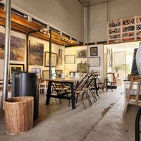 Inside seating and art at Studio Coffee in Arad