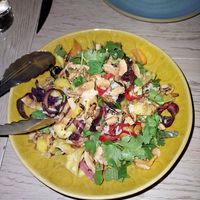 Pineapple salad with tons of veggies, coconut, and crispy rice at Girl & The Goat in Chicago
