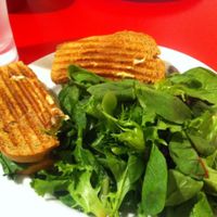 vegan chicken spinach and artichoke panini with side salad.  dip the panini in the balsamic vinegar for extra flavour! at Red Velvet Cafe - Fashion Show Mall in Las Vegas