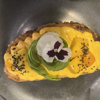 Delicious Mango Tango Toast with curry hummus & mango with an avocado rose 13,50  at The Avocado Show in Leidschendam