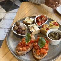 Starter with bruschetta, focaccia, focaccia with homemade vegan cheese, eggplant hummus, olives and ratatouille  at La Gastrobottega Di Giuseppe in Calpe