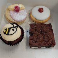 Left to right: lemon and raspberry empire biscuit, OG empire, chocolate cupcake, oreo brownie at Plant Blonde in Glasgow