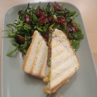 Vegan toasted sandwiches with arugula, balsamic glaze and dried tomatoes salad. at Kavárna Nota in Pardubice