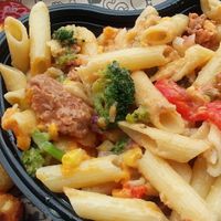 Custom mac bowl with gluten-free pasta, Beyond Sausage, veggies, vegan cheese sauce and melted vegan cheese slices. Side of tater tots. at I Heart Mac & Cheese in Naples