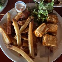 Tofu skewers enteee with salad and fries at Tin Box in Vieques