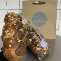 Vegan and Sugar-free Carob braided tsoureki with carob syrup, mastic and almonds!  at La Baguette in Athens