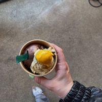 pistachio and peanut chocolate bomb and a spoon of mango   at Eisbrunnen - Vegan Ice Cream in Munich