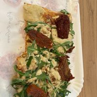 Cashew cream, rocket and sundried tomato pizza.  at La Prezzemolina in Rome