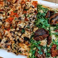 Vegan mushroom pizza and hummus & sun-dried tomato. Amazing! at La Prezzemolina in Rome