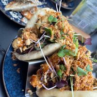 Satay cauliflower bao bun and mushroom Gyoza. at Kamado Kitchen  in Morzine