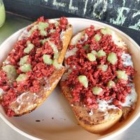Molletes: frijoles, queso gratinado, chorizo y salsita. at Mandragora Vegan in Mexico City