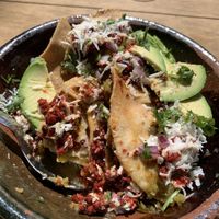 Chilaquiles (half eaten)  at Mandragora Vegan in Mexico City