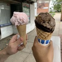 Strawberry ice cream on left. This is regular ice cream with dairy. Plain vegan cone was tasty as well.  at Goody Bassett's Ice Cream in Stratford