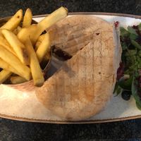 Vegan falafel and hummus deli sandwich with skin on fries. at Brambles Bistro in Robin Hoods Bay