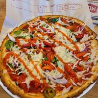 Cauliflower crust, plant based sausage with veggies and garlic, Sriracha drizzle at Mod Pizza - 5619 Texas 1604 Loop in San Antonio