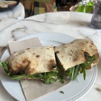 Cashew ricotta, courgette and rocket sourdough panini and an acai smoothie   at Di Marzano Cafe Vermuteria in Lisbon