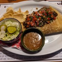 Pancake of the month: Sumatran Rendang with a jackfruit based curry-like topping, salad, sate sauce and chips. at D' Olle Smidse in Midwolda