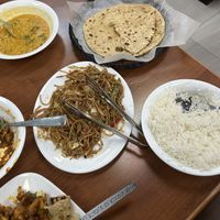 Clockwise from top left: Yellow dal, side of 2 rotis, side of rice, Chinese/Indian noodles, aloo gobi (potato-cauliflower dish)  at Satya Asha Veggie Food World in Surrey