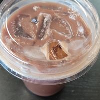 Iced Coffee Red Eye with oatmilk at Shelf Indulgence Used Book Cafe in Sarasota