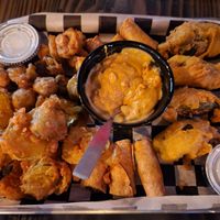 Vegan fried platter with vegan ranch & cashew queso. Fried mushrooms, pickles, Impossible beef taquitos, jalapeño poppers stuffed w/ Impossible beef and shredded v cheddar at Torque Grill & Cantina in Burleson