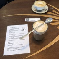 Gingerbread Latte + Cappucino in the back, Menu on the table as well  at Tattoo-Café Peckerl in Dresden