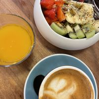 Acai bowl and oat milk coffee  at umami in Madrid