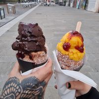 Dark chocolate on the left, mango on the right. Both dusted in coconut with raspberry topping at Sisters Kurtoš in Ljubljana