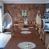 Common room (dinner table) at Surf Yoga Portugal in Ericeira