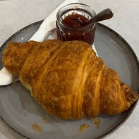 croissant with strawberry jam  at Karma Organic Coffee in Krakow