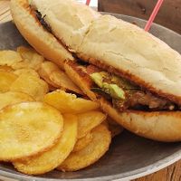 Calabacitas (their specialty tortas) charred zucchini with tomato, bean puree, avocado, guajillo chili sauce. at Señor Pico in Dubai