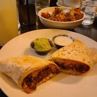 Breakfast burrito and a bowl of the sticky cauliflower and rice. at Botanical Plant-Based Fare in Charlottesville