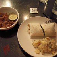 Many veggie wrap, herb roasted potatoes and fried pickles at Botanical Plant-Based Fare in Charlottesville