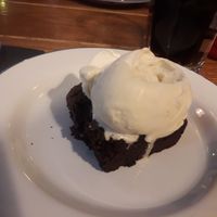 vegan brownie with vanilla ice cream, amazing! at Jeremiah's Taproom in Edinburgh