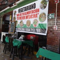 Poster and menu on patio area at Restaurante Union Vegetariano in Lima