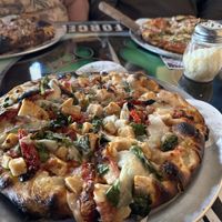 Pizza with vegan cheese, chicken, spinach, and sun dried tomatoes    at Task Force Pizza Co in Fort Walton Beach