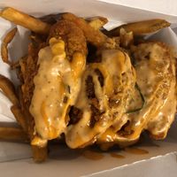 Twist hot tenders with fries … half the fries are gone 😬  at Twist Hot Chicken in Peoria