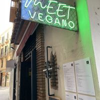 Entrance sign and menus  at Meet Vegano in Malaga