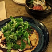 Braised tofu tortilla with fries and salmon tofu bowl at Meet Vegano in Malaga