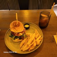The Holy Burger 🍔 and (partially drank) peach iced tea 🍑. 🤩 at Meet Vegano in Malaga