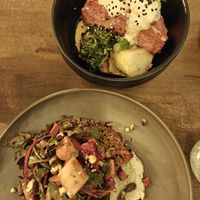 Salmon bowl and seitan salad at Meet Vegano in Malaga