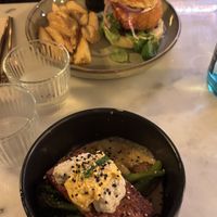 Crunchy meet burger (22€) and salmon broccolini bowl (20€). All vegan and would recommend 100%! So delicious    at Meet Vegano in Malaga