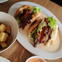 Burger in cheesy sauce at Meet Vegano in Malaga