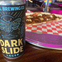 Dark Side Dark Lager w/ vegan pizza in background   at Revival Brewing & Lost Valley Pizza and Brewery in Providence