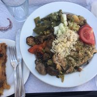 Plate by weigh and apple and raisins tart at Salsa Verde in Evora